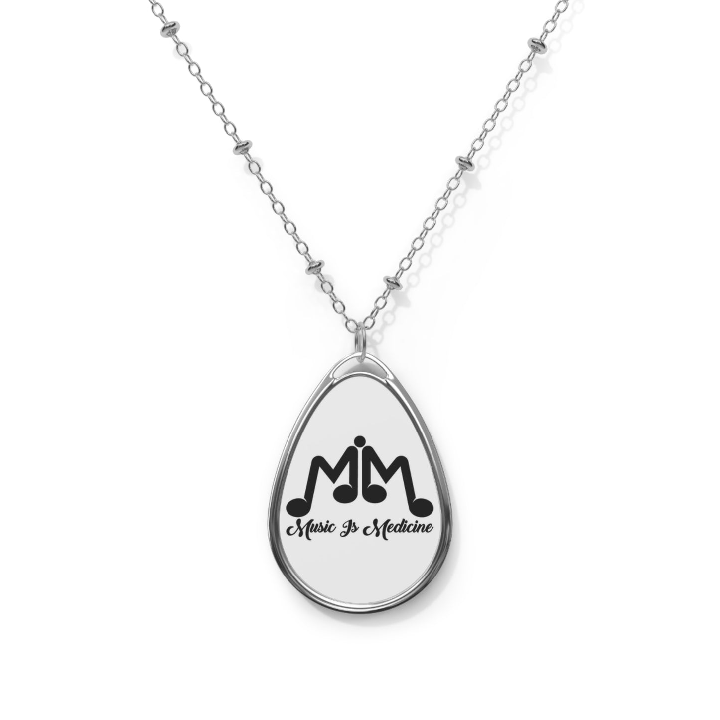 Oval Necklace with the Music Is Medicine stamped logo.